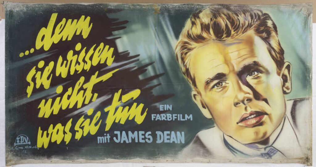 Filmplakat mit Schrift: Denn sie wissen nicht was sie tun und Abbildung eines Mannes (James Dean)